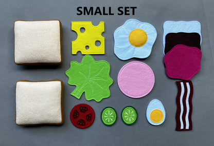 Set of felt food items including bread, cheese, eggs, and vegetables on a gray background. On top "Small Set" is written.