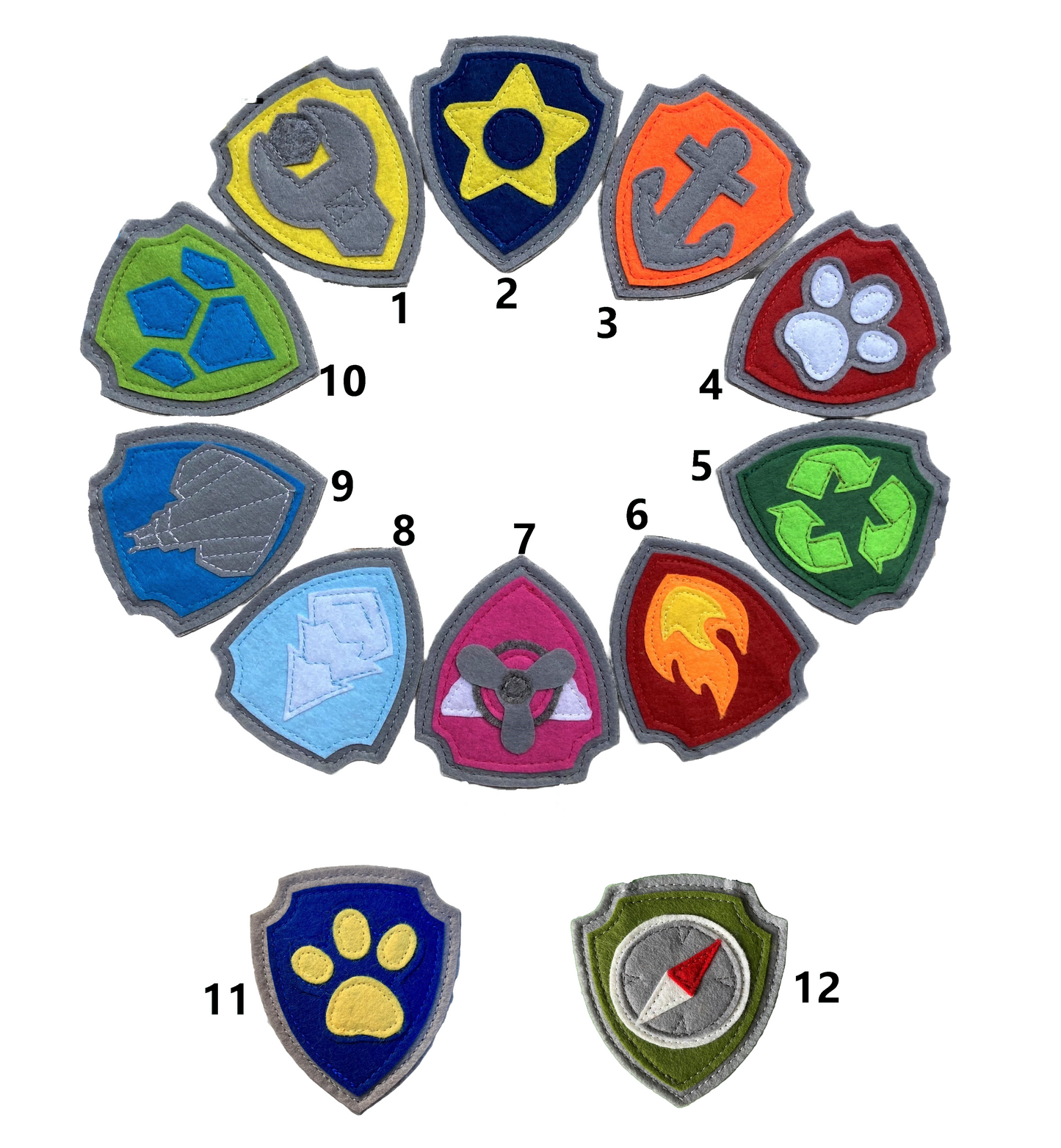 Set of colorful handmade felt paw patrol badges or patches with  symbols of character on the badge