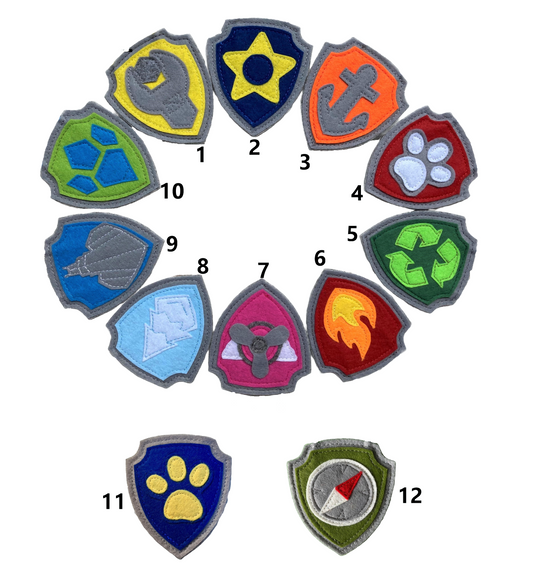 Set of colorful handmade felt paw patrol badges or patches with  symbols of character on the badge