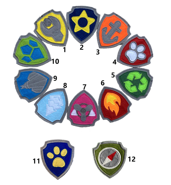 Set of colorful handmade felt paw patrol badges or patches with  symbols of character on the badge