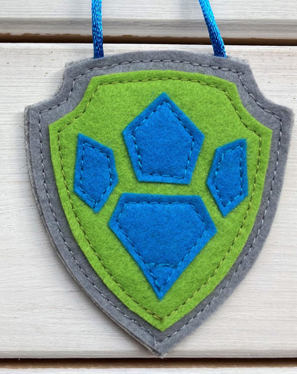 handmade felt paw patrol badges  with  symbols of characters on the badge