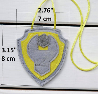 handmade felt paw patrol badges  with  symbols of characters on the badge