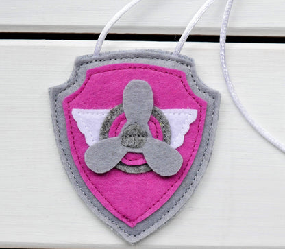 handmade felt paw patrol badges  with  symbols of characters on the badge