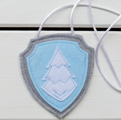 handmade felt paw patrol badges  with  symbols of characters on the badge