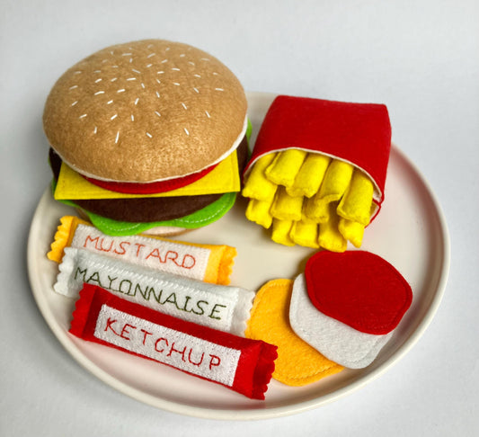 Handmade Felt food set including a hamburger, fries, and condiments presented on a plate.