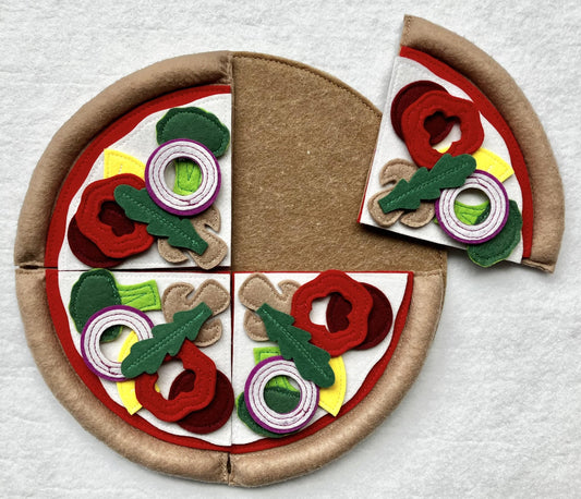 Handmade felt pizza toy with colorful toppings on a white background
